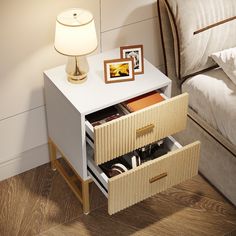 a night stand with two drawers and a lamp