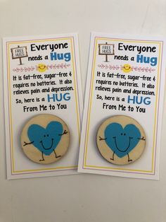 two magnets that say everyone needs a hug