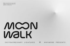 the moon walk logo is displayed on a white wall with black lettering and a light fixture