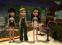 three cartoon dolls are standing next to each other in front of a table and chairs