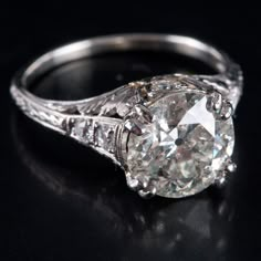 Vintage 1900's Platinum H SI2 Transitional Diamond Engagement Ring 3.10ctw 3.95gMetal Information: .900 PlatinumTotal Weight: 3.95gBand Width: 1.40mmSize: 6.75Circa: 1900'sAdditional Information: Girdle Abraded / Shows WearStone InformationMain StoneGem Type: DiamondShape: Transitional Round (9.3mm)Color: HClarity/Quality: SI2Carat Weight: 2.94ctNumber of Stones: 1Accent StonesGem Type: DiamondShape: Round (2.0mm)Color: HClarity/Quality: SI2Carat Weight: .03ctNumber of Stones: 4Accent StonesGem Stassi Schroeder Engagement Ring, Ring Resetting Before After, Antique Ring Settings, 3 Carat Ring, European Cut Diamond Engagement Ring, Estate Engagement Ring, Jewerly Ring, European Cut Diamond Ring, Estate Diamond Jewelry