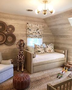 a baby's room with wooden walls and giraffe stuffed animal in the corner