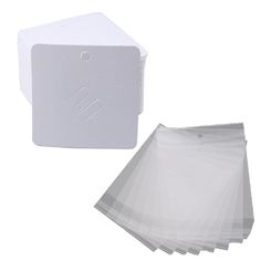 several pieces of white paper sitting next to each other