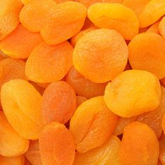 close up view of peeled oranges with water droplets on the top and bottom surface