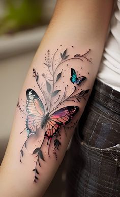 a woman's arm with a butterfly and flower tattoo on the left side of her arm