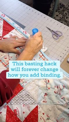 a woman is using scissors to sew fabric on a piece of cloth with the words, this basting hack will forever change how you add binding