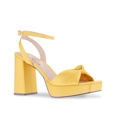 Nina-Seline Platform Sandal Summer fashion doesn't have to be difficult when you've got the N by Nina Selina platform sandal. A bow-tie toe strap gives a feminine touch to the adjustable sandal, elevated by a matching block heel. A neatly cut square toe brings an edgy finish. Hoco Shoes, Special Occasion Shoes, Yellow Sandals, Yellow Heels, Trending Sneakers, Open Toe Shoes, Shoe Carnival, Wedding Heels, Athletic Fashion