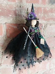 a doll is dressed up as a witch