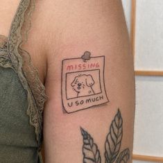 a woman's arm with a missing u - so much tattoo on the side