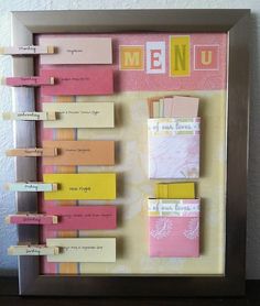 a framed menu board with sticky notes attached to the wall and magnets on it