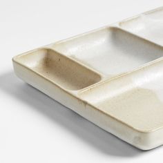 two white trays sitting side by side on top of each other in front of a white background