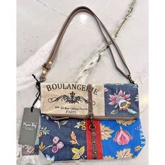 This Charming Crossbody Bag From Myra Boulangerie Is Perfect For Any Fashion-Savvy Woman. The Exterior Is Adorned With A Vibrant Floral Pattern On Canvas, While The Lining Is A Soft Beige Cotton Material. The Bag Features A Small Size And A Brown Leather Handle/Strap That Adds A Touch Of Sophistication To The Overall Design. With Its Unique Style And Beautiful Details, This Myra Crossbody Bag Is A Must-Have For Any Woman Who Wants To Make A Fashion Statement. It Is Perfect For Carrying Everyday Floral Embroidered Crossbody Shoulder Bag For Daily Use, Embroidered Leather Crossbody Bag, Handmade Multicolor Embroidered Crossbody Bag, Brown Floral Print Crossbody Shoulder Bag, Multicolor Embroidered Floral Crossbody Shoulder Bag, Leather Handle, Cotton Material, Fashion Statement, Everyday Essentials Products