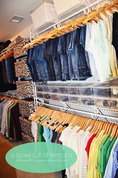 a closet filled with lots of shirts and pants