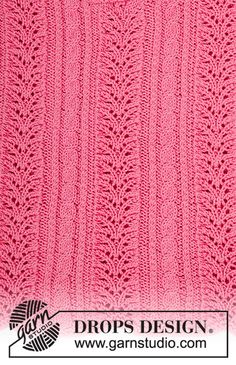 a pink knitted blanket with an intricate design