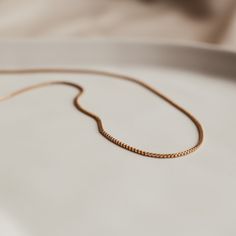 Add a touch of sophistication with our sleek Aria box chain necklace. Super versatile this chain is perfect for the single necklace minimal but elegant look or add to your necklace stack for a bit more texture. Modern Everyday Necklace With Curb Chain, Modern Curb Chain Necklace For Everyday, Modern Everyday Curb Chain Necklace, Timeless Delicate Chain Necklace In Rose Gold, Dainty Rose Gold Necklace With Curb Chain, Everyday Minimalist Necklace With Curb Chain, Timeless Everyday Delicate Chain Necklace, Timeless Delicate Chain Necklace For Everyday, Everyday Rose Gold Chain Necklace