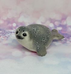 This beautiful and cute mini seal is carefully hand crafted from polymer clay and then hand decorated in fine design. After baking each figurine is coated with protective gloss waterproof varnish. Each of my mini animals is unique and original. This beautiful figurine is perfect decoration for your desk or shelfs. Comes in gift box so it's perfect gift for yourself or somebody you love. Note: all animals are very small in size (about 6cm) and please don't use it as a toy for little children. If Clay Seal Animal, Polymer Clay Seal, Seal Polymer Clay, Clay Seal, Mini Animals, All Animals, Mini Figurine, Baby Penguins, Love Note