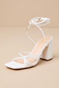 The Lulus Nouvel White Strappy Lace-Up High Heel Sandals are the perfect finishing touch to your soiree look! Smooth faux leather shapes these must-have sandals with a square toe bed and a network of toe straps with a knotted detail at the side. Long laces (with gold aglets) sprout from the sides to wrap around and tie above the ankle, all atop a trendy block heel. 3. 5" wrapped block heel. Cushioned insole. Rubber sole has nonskid markings. Man made materials. Imported. Lulus | Nouvel White Str Off White Heels, Lulus Heels, Hoco Heels, Summer Strappy Sandals, Hoco Shoes, 2025 Wardrobe, Trendy Block Heels, White Sandal, Shoe Heels