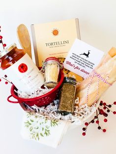 a basket filled with different types of food and condiments next to a card