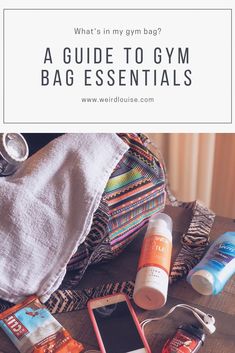 the contents of a gym bag with text overlay that reads, what's in my gym bag? a guide to gym bags essentials