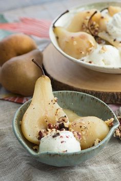 two bowls filled with ice cream and pears