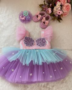 Along with the dress, a mermaid themed hair clip is sent as a gift. 🎁 Handmade dresses for your baby are prepared with soft cotton lining. It has a zipper on the back, very easy and comfortable to wear. The hologram mermaid is made with sequins.  👉🏻 you can leave a message for more questions  👉🏻 It is a handmade dress that we can prepare for the person. Very dense tulle layers are used, very fluffy, personalized color options are available, you can personalize  ✈️Delivery to many countries Mermaid Party Dress, Costume Mermaid, First Birthday Dress, Mermaid Theme Birthday Party, Ariel Dress, First Birthday Dresses, Mermaid Theme Birthday, Mermaid Theme