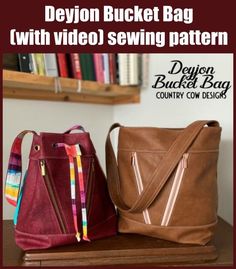 two purses sitting next to each other on top of a wooden table with text overlay that reads, devion bucket bag with video sewing pattern