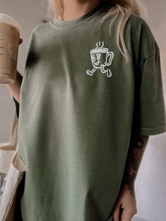 These tees are printed on super soft Comfort Colors, providing a relaxed unisex fit with a worn-in look and feel. This collection offers our most expanded size range from S-3X.Looking for these tees to fit oversized? Size up 1-2 sizes.Model is wearing a size XL for an oversized fit• 100% ring-spun cotton• Garment-dyed• Relaxed fitThis product is made especially for you as soon as you place an order, please see the banner on the top of our site for current turnaround times. Making products on dem Casual Green T-shirt For Everyday, Comfortable Graphic Print T-shirt, Oversized Green T-shirt With Graphic Print, Comfortable Crew Neck T-shirt With Letter Print, Casual Comfortable Fit T-shirt With Letter Print, Soft-washed Relaxed Fit Crew Neck T-shirt, Crew Neck T-shirt With Letter Print For Loungewear, Oversized Casual T-shirt For Loungewear, Short Sleeve T-shirt With Letter Print For Loungewear