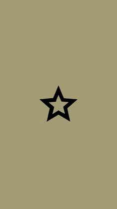 a black and white star on a tan background