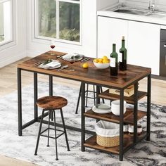 a kitchen table with two stools next to it