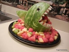 a watermelon shaped like a shark with its mouth open