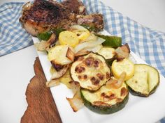 a white plate topped with meat and veggies