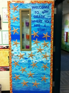 a door decorated with sand and starfish on the front, welcome to 4th grade where you are a star