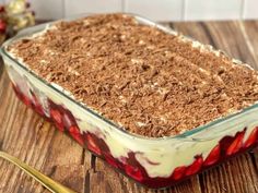 a dessert in a glass dish on a wooden table