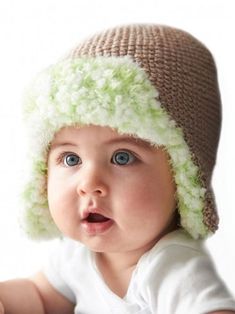 a baby is wearing a knitted hat