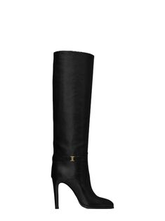 BOOTS WITH A STILETTO HEEL AND ALMOND TOE, FEATURING AN ANKLE STRAP WITH AN ARCHIVE CASSANDRE GUILLOCHÉ METAL BUCKLE. LEATHER SOLE TOTAL HEEL HEIGHT: 10 CM / 3.9 INCHES CALFSKIN LEATHER Saint Laurent Boots, Charlotte Gainsbourg, Tall Boot, Crossbody Clutch, Boots And Sneakers, Designer Boots, Tall Boots, Leather Fashion, Wedge Sandals