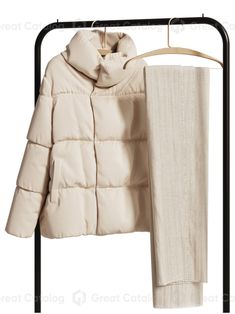 a coat hanging on a clothes rack next to a pair of pants and a scarf