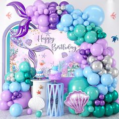 a mermaid themed birthday party with balloons and decorations