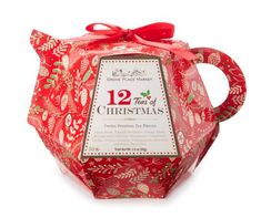 the twelve days of christmas tea in a red gift box with a ribbon tied around it