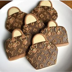 cookies shaped like louis vuitton bags on a plate