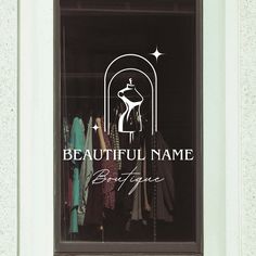 a window that has some clothes in it and the words beautiful name written on it