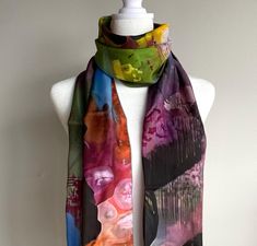 This periwinkle, green, pink, and white scarf in silk or poly chiffon features a tie dye pattern inspired by one of my one of a kind paintings.  * Two Fabric Options: Silk Habotai, and Poly Chiffon * Two sizes: 10" x 45" and 16" x 72" Made from 100% polyester fabric or silk * Very soft hand, lovely drape * Print is visible about 50% on the back side * Each scarf is printed and sewn by hand in Montreal, Canada * Vivid print that will never fade after washing * Machine wash in cold water with phosphate free detergent, hang to dry, iron on synthetic setting, may shrink after the first wash Silk Habotai: delicate yet durable accessories, this item features a reactive printed 100% silk scarf, available in silk habotai, featuring my artwork. The unique reactive print process means the print will Silk Scarves For Summer, Summer Multicolor Shawl As Gift, Multicolor Summer Shawl As Gift, Multicolor Shawl As Summer Gift, Purple Scarves As Summer Gifts, Pink Hand-dyed Scarf, Summer Hand-dyed Tie-dye Scarves, Artistic Summer Shawl Scarf, Bohemian Hand-dyed Scarves For Spring