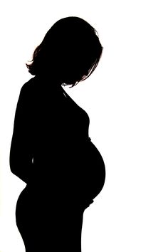 the silhouette of a pregnant woman is shown