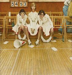 three women in white uniforms sitting next to each other on wooden benches with numbers painted on the wall behind them