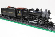 a lego train is shown on the tracks