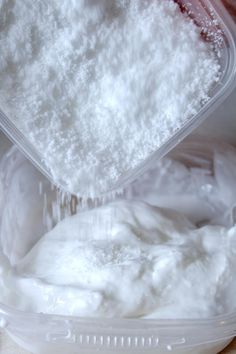 a container filled with white powder on top of a table