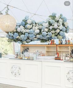 the bar is decorated with blue and white flowers