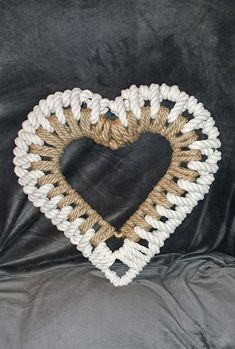 a heart shaped frame made out of rope