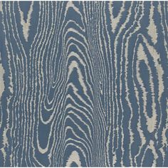 a blue and white rug with wavy lines on it