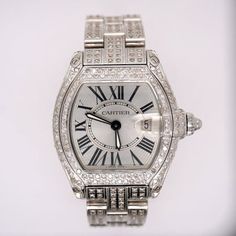 Cartier Roadster 20mm Ladies Watch Customized With 5.00 Carats of Genuine Diamonds! The Entire Case, Band Buckle, and Bezel Have Been Beautifully Set in White "SI" Round Brilliant Cut Diamonds. The Diamonds are G/H in Color. Retail Price After Customization Over $10,000. Size: one size.  Color: Silver.  Gender: female.  Age Group: adult. Cartier Silver Diamond Watch For Evening, Iced Out Cartier Watch, Cartier Luxury Silver Diamond Watch, Cartier Rectangular White Gold Diamond Watch, Cartier Diamond Watch With Polished Finish, Cartier Roadster, Ladies Watch, G H, Round Brilliant Cut Diamond