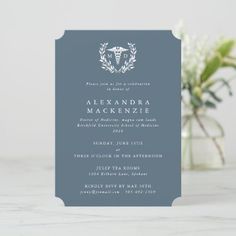 a blue and white wedding card with a wreath on it